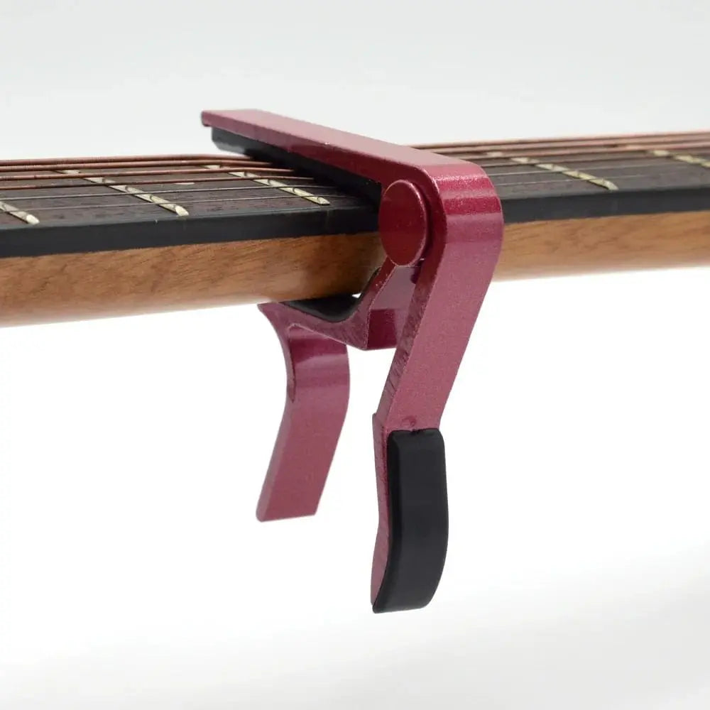 Guitar capo for string instruments
