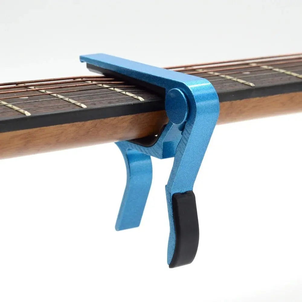 Guitar capo for string instruments